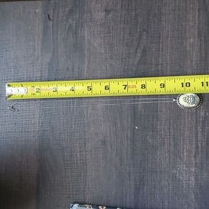 Scrimshaw ship necklace